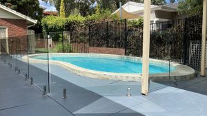 Frameless pool fencing around shapely pool adelaide