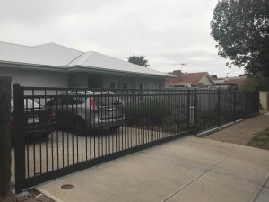 Custom Flat Rail Sliding Driveway gate and front fencing by Reliance Fencing in Adelaide by Reliance Fencing Adelaide