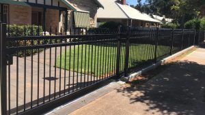 Sliding Gate at Woodville. Concrete footing, panels and sliding gate by Reliance Fencing Adelaide