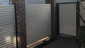 Aluminum slat Access Gate, with contrasting frames and posts and 10mm gaps.
