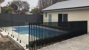 Frameless glass and rail less blade pool fence at Beulah Park.